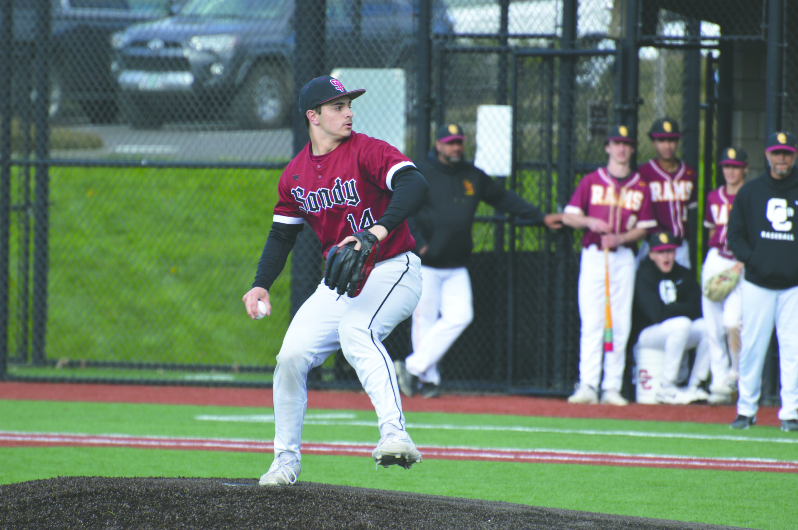 Athlete pitches at a baseball game