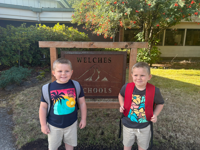 two boys with back packs are ready for their first day of school