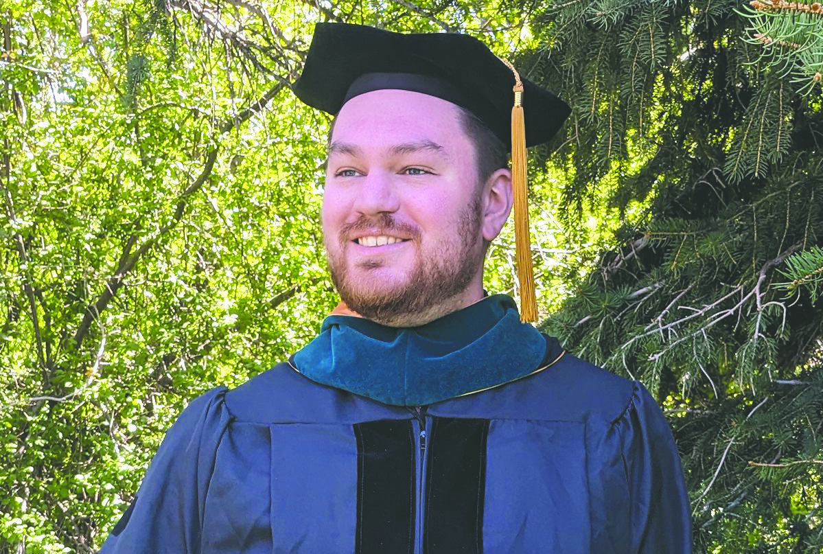 Stewart poses happily in his cap and gown