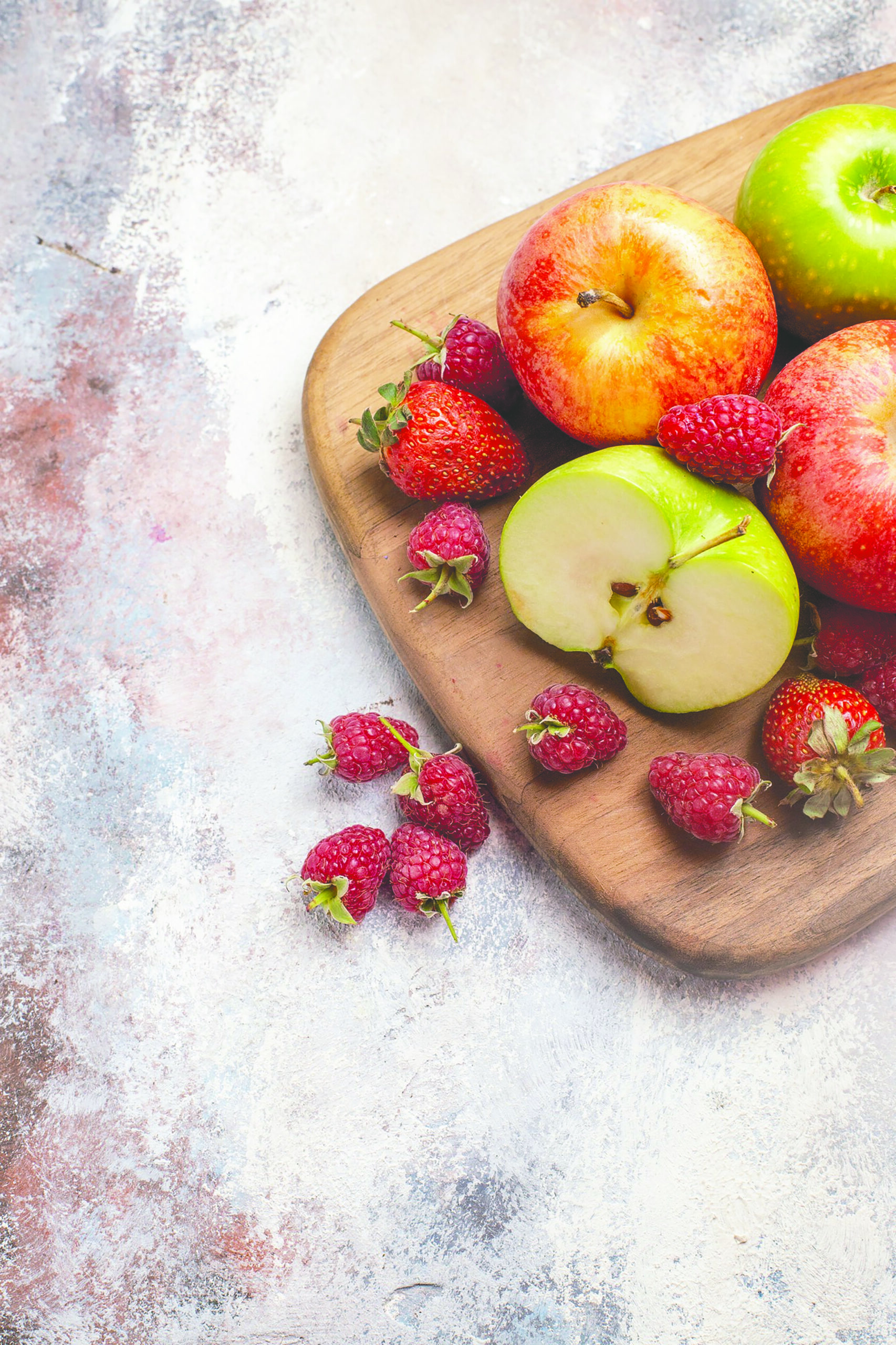 a board of fruit and berries