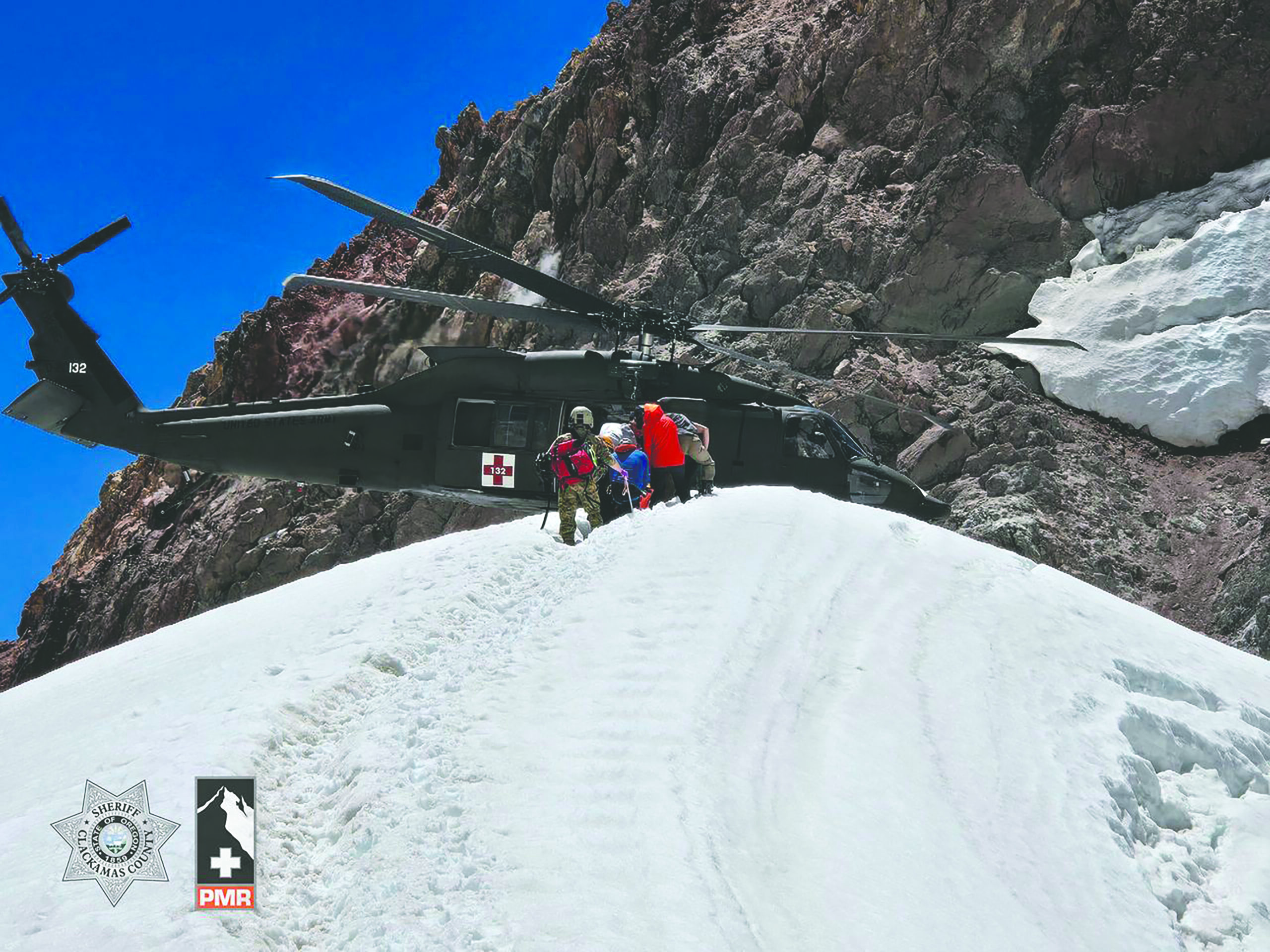 an emergency helicopter ready to take off from the mountain