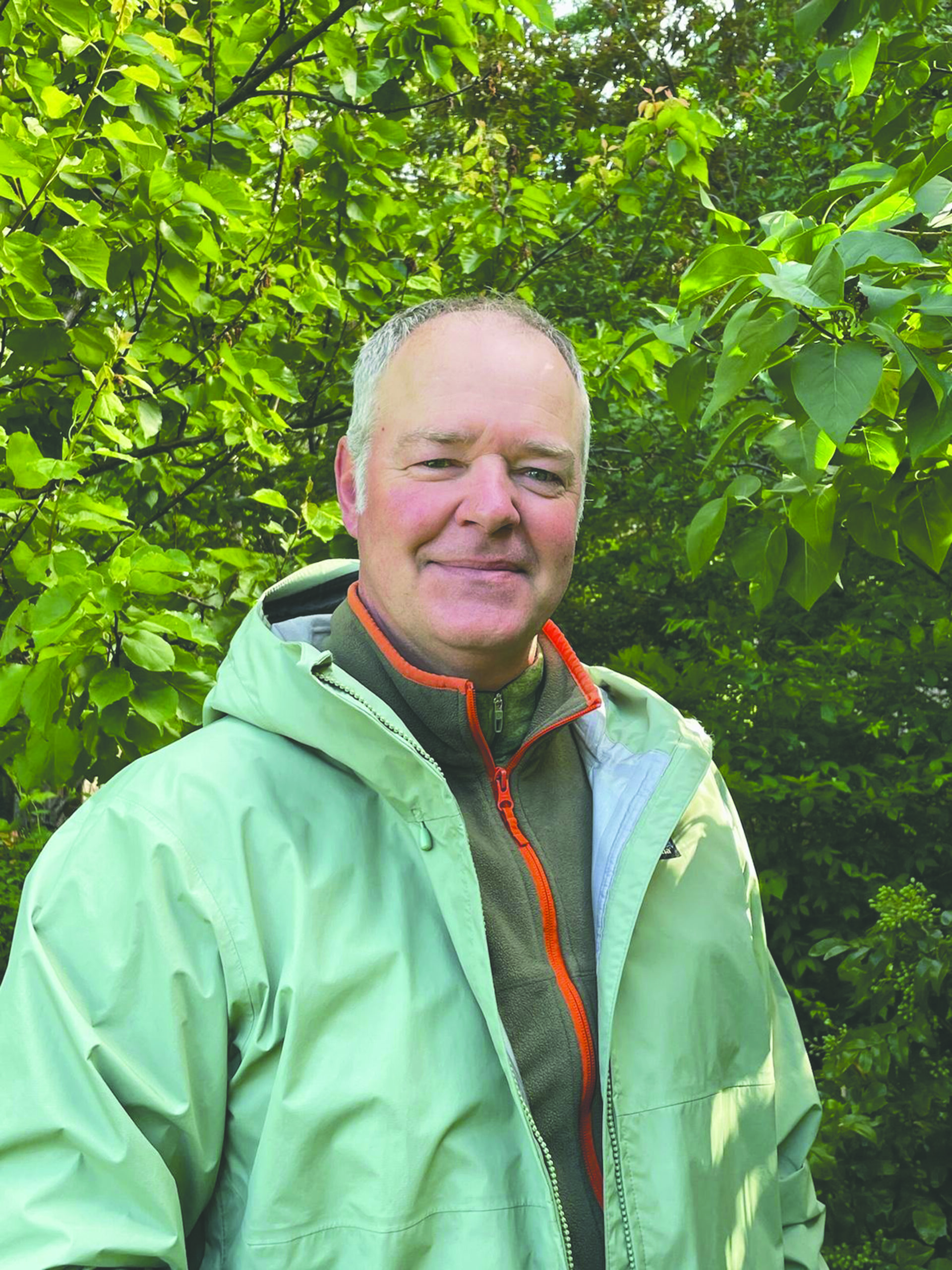 a man poses for a photo