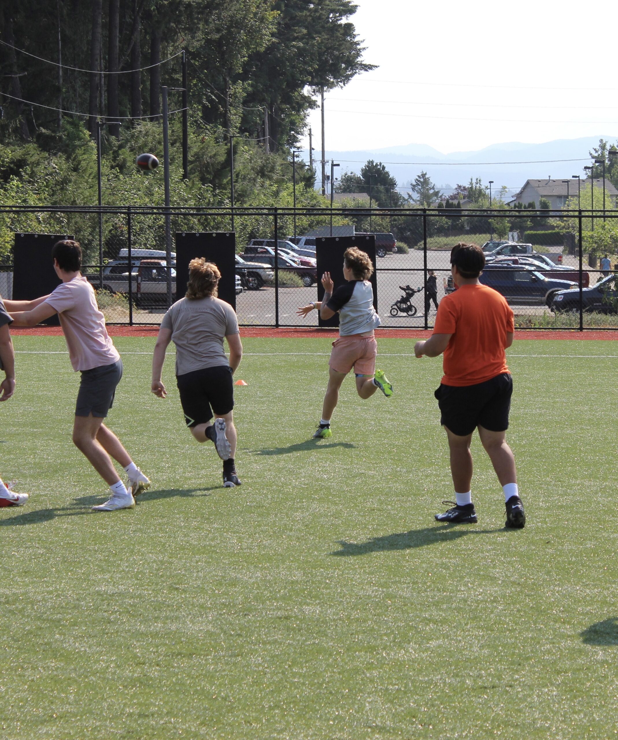 athlete runs to catch a ball