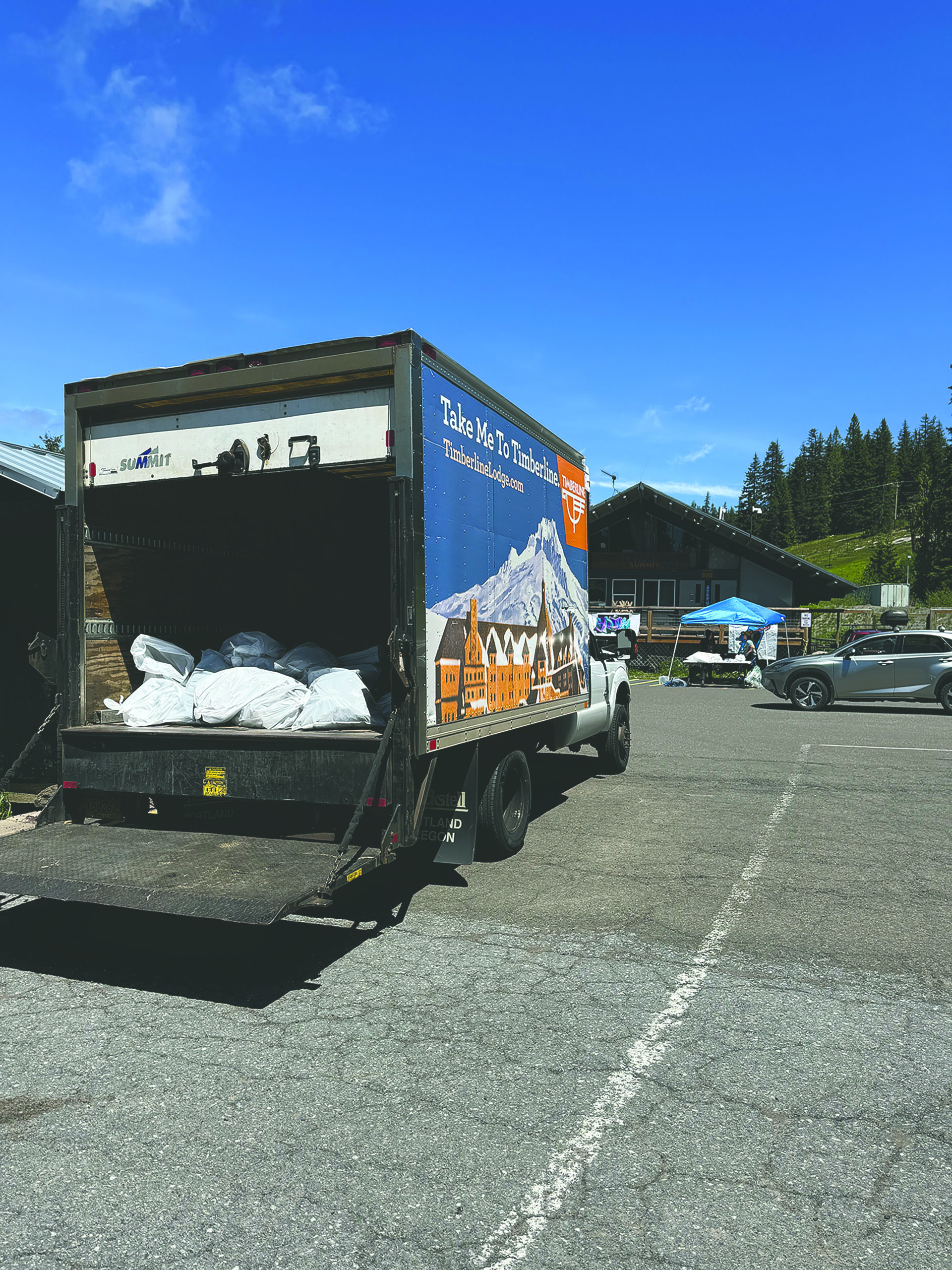 a truck is full of trash ready to be taken away