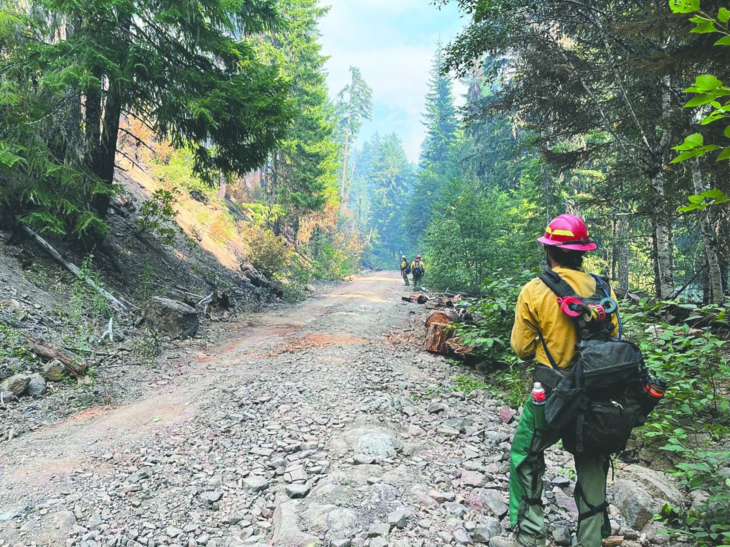 Firefighters working on a trail