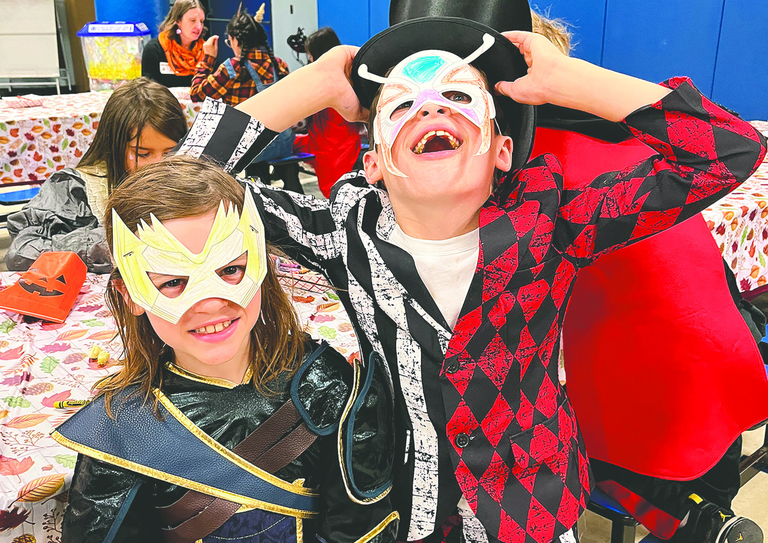 Kids are excited to be dressed up for Halloween show off the masks they made