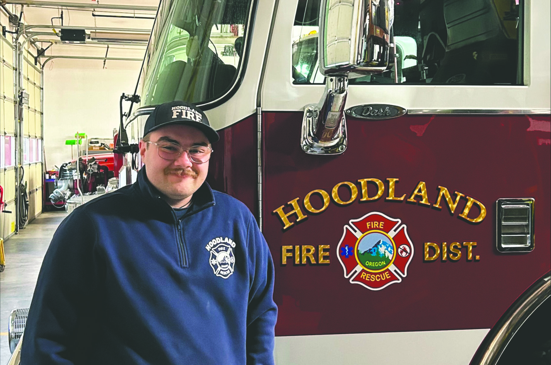 Vincent poses in front of a hoodland fire engine