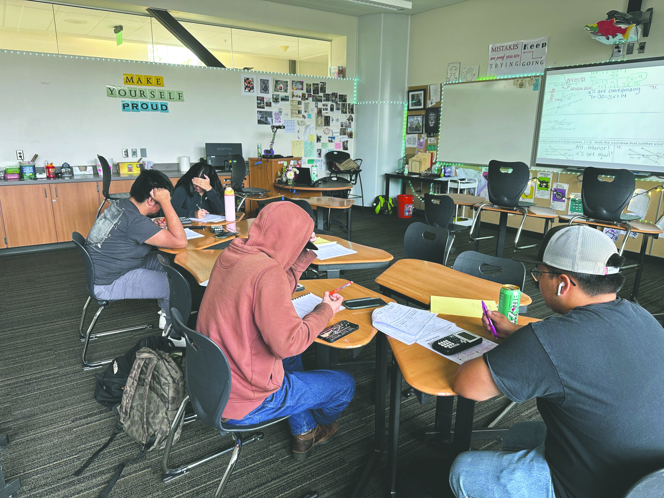 A class room of kids study geometry