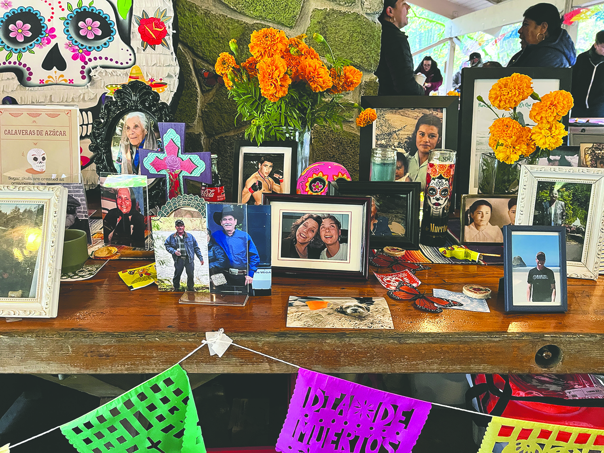 photos and offerings on an ofrenda