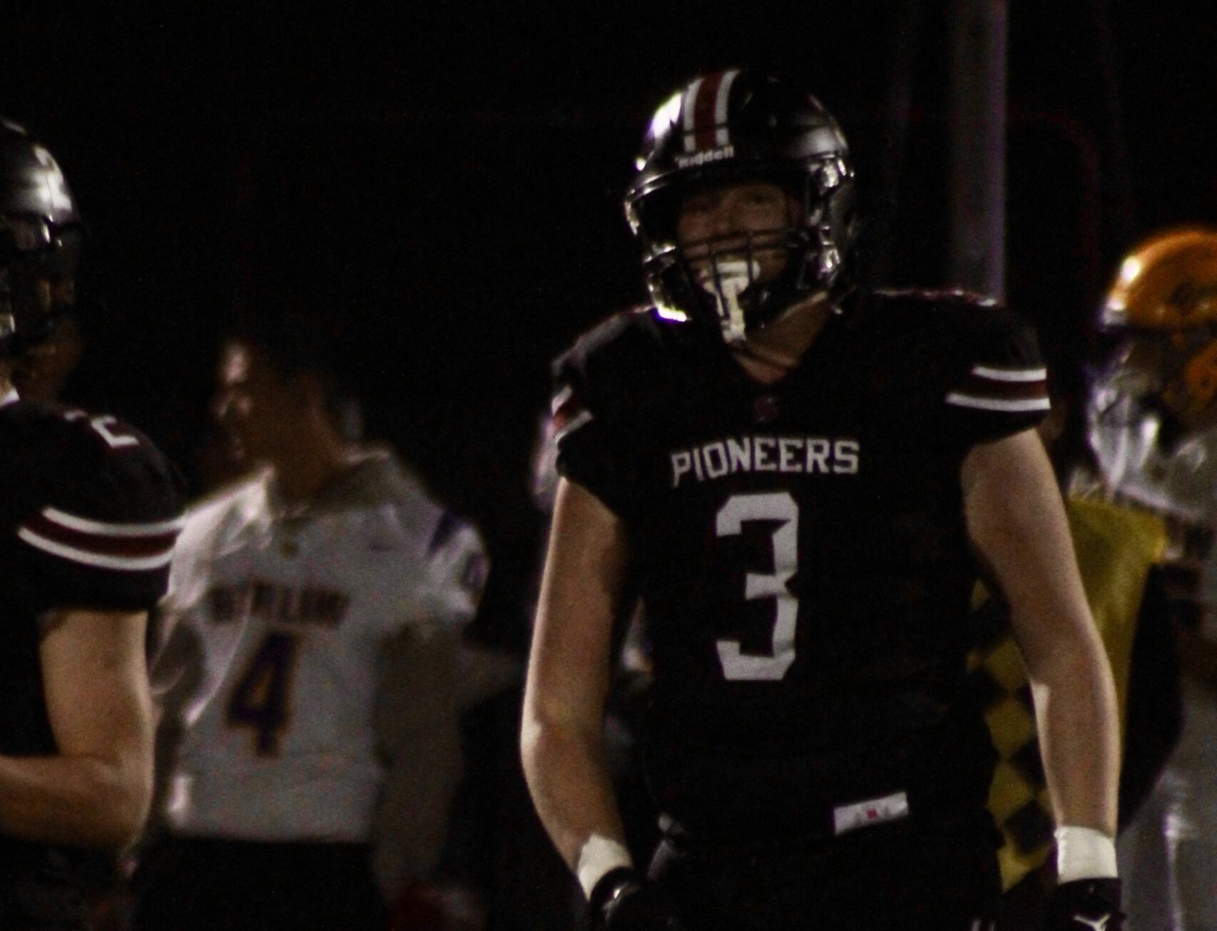 football player gets ready for the next play